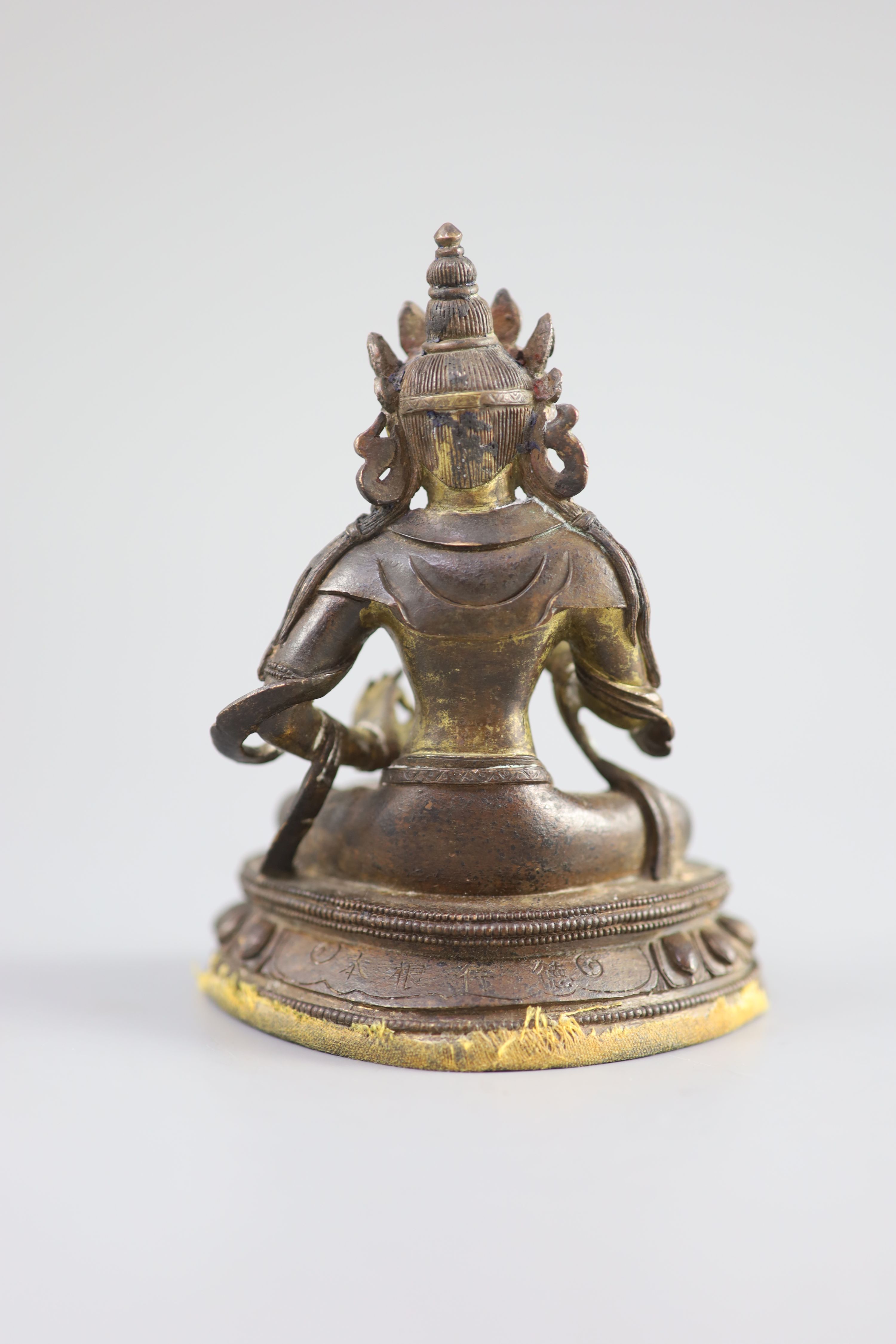 A Chinese gilt bronze figure of Amitayus, Qianlong mark and period (1736-95), 12.5 cm high